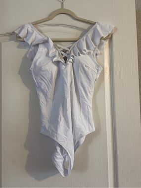 Ruffled White One-Piece Swimsuit with Lace-Up Front